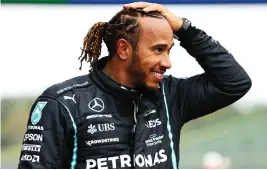  ??  ?? A happy Lewis Hamilton after qualifying on pole at Imola