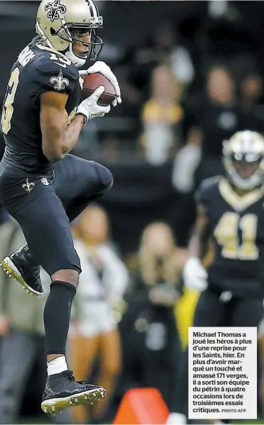  ?? PHOTO AFP ?? Michael Thomas a joué les héros à plus d’une reprise pour les Saints, hier. En plus d’avoir marqué un touché et amassé 171 verges, il a sorti son équipe du pétrin à quatre occasions lors de troisièmes essais critiques.