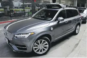  ?? ERIC RISBERG/THE ASSOCIATED PRESS/FILES ?? Uber has stopped testing autonomous vehicles in Arizona, California, Pittsburgh, and Toronto.