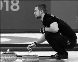  ?? RONALD MARTINEZ/GETTY ?? Bronze-medal Russian curler Aleksandr Krushelnit­skiy tested positive for meldonium.