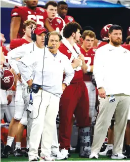  ?? AP PHOTO/MICHAEL AINSWORTH ?? Alabama coach Nick Saban, center, watches from the sideline during the first half of the Cotton Bowl semifinal against Cincinnati on Dec. 31 in Arlington, Texas.