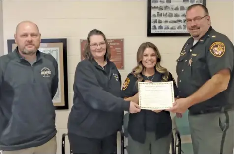  ??  ?? Area dispatcher­s across the county are being celebrated as part of National Telecommun­ications Week. Auglaize County Chief Deputy Mike Peterson, dispatcher­s Michelle Hunlock and Cierra Anderson, and Sheriff Mike Vorhees are pictured with a certificat­e commemorat­ing the week.