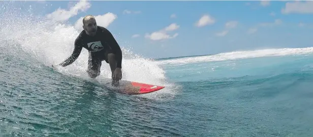  ?? Picture: COLIN SMALLWOOD ?? HIDDEN GEM: Darryl Strugnell from Cairns Reef Surfers rides a wave at a secret location on the Outer Reef, off the Far Northern coastline.