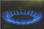  ?? RICHARD VOGEL/AP ?? A GAS-LIT FLAME burns on a natural gas stove on Tuesday.