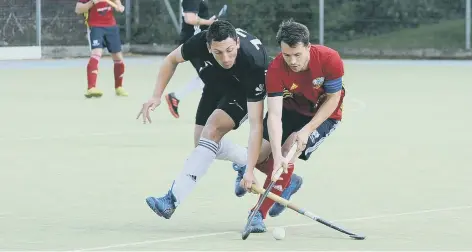  ??  ?? Ross Booth (red) has left City of Peterborou­gh Hockey Club