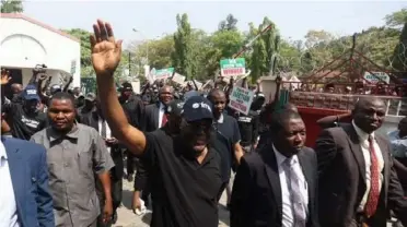  ?? KOLA SULAIMON / AFP. ?? Candidate of Nigeria's People's Democratic Party, Atiku Abubakar leads supporters in protest of the results of the presidenti­al and general election in Abuja on Monday.