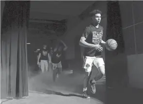  ?? ?? Ohio State guard Tanner Holden enters the court prior to a game against Northweste­rn.