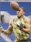  ??  ?? Nevada defensive back Khalid Wooten attempts to catch a ball during the NFL football scouting combine
in Indianapol­is, Feb 26. (AP)