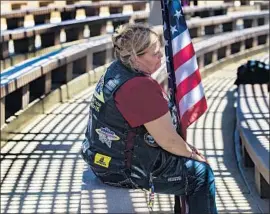  ?? Gina Ferazzi Los Angeles Times ?? SUE MORSE of Fullerton chokes up at David Rosenkrant­z’s funeral. Morse’s father is a Navy veteran of World War II and a recipient of the Purple Heart.