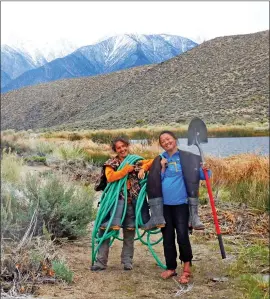  ?? Photo courtesy of Eastern Sierra Land Trust ?? Monitoring work takes getting muddy boots onto the ground.