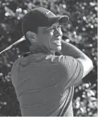  ?? MICHAEL MADRID/USA TODAY SPORTS ?? Tiger Woods plays his shot from the 15th tee during the third round of the Masters on Nov. 14, 2020, in Augusta, Ga.