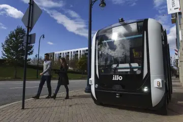  ??  ?? Olli, an automated shuttle, stands outside the offices of Local Motors at National Harbor in Oxon Hill, Maryland, on Nov. 20. The vehicles run about 10 miles per hour, and are seen as a gateway to greater automation. — WP-Bloomberg photo by Michael Robinson Chavez