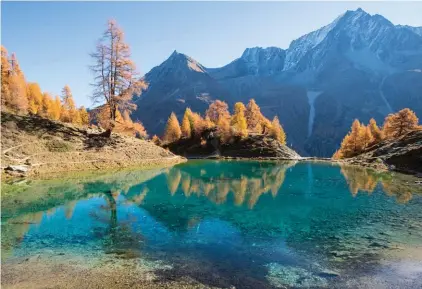  ??  ?? Lake Lac Bleu is pictured during a beautiful autumn day, near Arolla, in Valais, Switzerlan­d yesterday Photo: AP