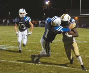  ??  ?? Rockmart’s Maurice Smith drives forward during the second half on a run and gets dragged down by Bremen’s Wade O’Neal on Friday, Sept. 18.