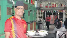  ??  ?? LEFT Mochchhe Chandra Baral, 44, and about a third of his co-workers at the Bakery Cafe chain cannot hear.