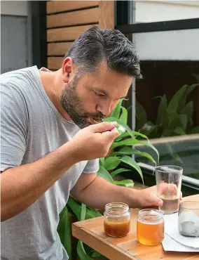  ??  ?? Oren recommends trying his mead with the honey from which it’s made. Taste some clover honey, then take a sip of mead, and repeat the process with manuka – you’ll notice the two varieties bring out different notes in the mead. Lone Bee mead, with its distinctiv­e label, is stocked at selected bars including Pocket in Auckland’s Grey Lynn.