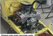  ??  ?? Original crate motor had triple carbs.