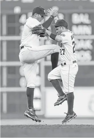  ?? Karen Warren / Houston Chronicle ?? Halfway through the season, Astros shortstop Carlos Correa, left, has driven in a team-high 51 runs. Many of those RBIs helped second baseman Jose Altuve score a team-best 62 times.