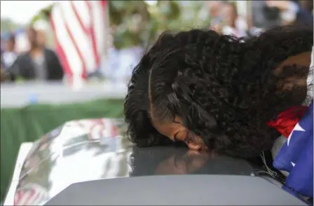  ?? MATIAS J. OCNER — MIAMI HERALD VIA AP, FILE ?? Myeshia Johnson kisses the casket of her husband, Sgt. La David Johnson during his burial service at Fred Hunter’s Hollywood Memorial Gardens in Hollywood, Fla. Myeshia Johnson told ABC’s “Good Morning America” on Monday that she has nothing to say to...