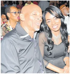  ??  ?? Journalist Clinton Pickering wears matching colours with his date Renee McHayle at the official opening of the Grand-A-View.