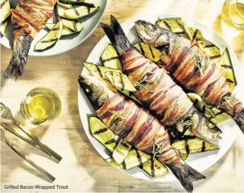  ?? JUSTIN TSUCALAS For The Washington Post ?? Grilled Bacon-Wrapped Trout.