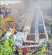  ?? PTI ?? Five people were feared dead as the bus fell into a roadside pit.