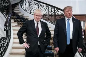  ?? ERIN SCHAFF ?? FILE - In this Sunday, Aug. 25, 2019 file photo President Donald Trump and Britain’s Prime Minister Boris Johnson, left, speak to the media before a working breakfast meeting at the Hotel du Palais on the sidelines of the G-7 summit in Biarritz, France. British Prime Minister Boris Johnson has said a lot of nice things about Donald Trump over the years, from expressing admiration for the U.S. president to suggesting he might be worthy of the Nobel Peace Prize. But after a mob of Trump supporters invaded the U.S. Capitol on Jan. 6, Johnson has changed his tune.