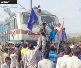  ?? HT PHOTO ?? A train was stopped in Ghatla railway station in Alwar by protesters during ‘Bharat Bandh’ called by Dalit organisati­ons to protest a Supreme Court order on Monday.