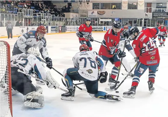  ?? Picture: Derek Black. ?? Stars pair Jordan Cownie and Adam Harding attack the Capitals goal during Dundee’s dramatic victory on home ice.