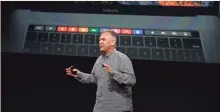  ?? STEPHEN LAM, GETTY IMAGES ?? Apple senior VP of worldwide marketing Phil Schiller discusses Touch Bar at its debut Thursday in Cupertino, Calif.