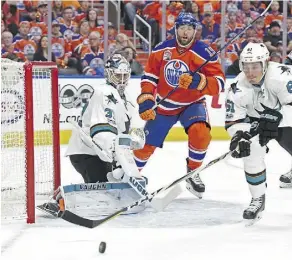  ?? SHAUGHN BUTTS ?? Oilers forward Patrick Maroon tries to hunt down a rebound Friday in front of Sharks goalie Martin Jones. Edmonton enjoyed a 1-0 lead after two periods in Game 2 thanks to a Zack Kassian goal.