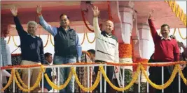  ?? PIC/MPOST ?? AAP convener Arvind Kejriwal, Manish Sisodia, Satyender Jain and Kailash Gahlot wave after being sworn in as ministers at Ramlila Maidan in New Delhi, on Sunday