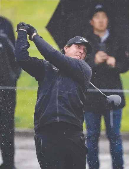  ??  ?? SOGGY START: Phil Mickelson tees off on the 10th hole during the first round of the US PGA Tour Genesis Open.