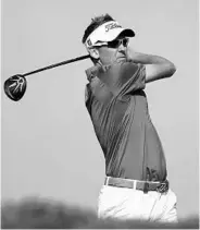  ?? SCOTT HALLERAN/GETTY IMAGES ?? England’s Ian Poulter is 1 of 5 golfers tied for the lead at 10-under after 3 rounds of the Abu Dhabi HSBC tourney.