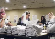  ?? Paul Buckowski / Times Union ?? Absentee ballots from the primary are counted July 1 at the Rensselaer County Board of Elections in Troy.