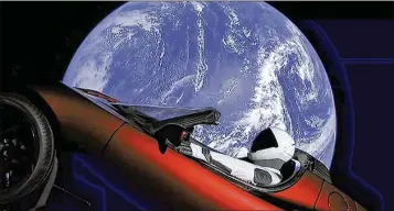  ?? SPACEX ?? Elon Musk’s red Tesla Roadster was launched into space during the first test flight of the Falcon Heavy rocket on Tuesday and is headed toward the asteroid belt beyond Mars. A mannequin is at the wheel.