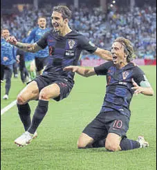  ?? REUTERS ?? Croatia's Luka Modric (right) celebrates after scoring their second goal against Argentina on Thursday.