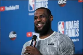  ?? CARLOS OSORIO — THE ASSOCIATED PRESS FILE ?? LeBron James takes questions at a press conference.