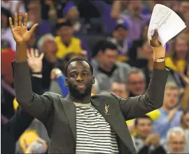  ?? JOSE CARLOS FAJARDO — STAFF PHOTOGRAPH­ER ?? Draymond Green gestures after a dunk by Warriors teammate Andre Iguodala. Green didn’t play because of a finger injury, but helped lead strategy sessions during timeouts.