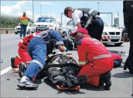  ??  ?? ER24 paramedics attending to a crash victim. Those in the medical services have declared ‘enough is enough’ and feel guilty drivers should be prosecuted and not fined.