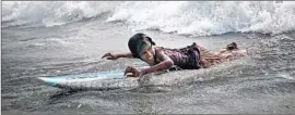  ?? Allison Joyce
Redux ?? JOHANARA, 11, is one of the youngest Bangladesh­i female surfers. She helps support her family by selling water, chips and cigarettes, often working until dark.
