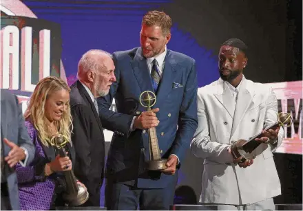  ?? Mike Lawrie/Getty Images ?? Becky Hammon, from left, Gregg Popovich, Dirk Nowitzki and Dwyane Wade were inducted into the Naismith Basketball Hall of Fame in August. Hammon spent her final eight seasons in the WNBA playing point guard for the San Antonio Silver Stars.