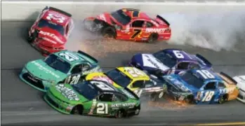  ?? JOHN CHILTON — THE ASSOCIATED PRESS ?? Daniel Hemric (21), Erik Jones (20), Brandon Jones (33), Scott Lagasse Jr (24), Justin Allgaier (7), Darrell Wallace Jr (6) and Daniel Suarez (18) crash during Saturday’s Xfinity series race in Daytona Beach, Fla.