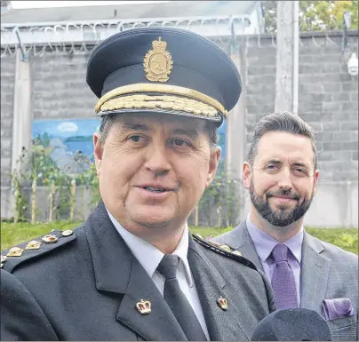  ?? JOE GIBBONS FILE PHOTO/THE TELEGRAM ?? Owen Brophy (left), superinten­dent of prisons for Newfoundla­nd and Labrador, and Minister of Justice and Public Safety Andrew Parsons speak to reporters at Her Majesty’s Penitentia­ry on Wednesday.