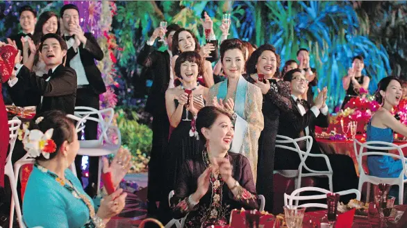  ??  ?? Michelle Yeoh, centre, is part of an all-Asian cast starring in one of the summer’s most buzzed-about movies, Crazy Rich Asians, based on the best-selling novel.