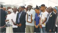  ?? (Marc Israel Sellem/The Jerusalem Post) ?? ETHIOPIAN ISRAELIS bow their heads yesterday at a ceremony on Mount Herzl in Jerusalem rememberin­g the thousands of Jews who died en route from Africa to Israel.