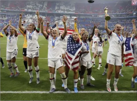  ?? DAVID VINCENT - THE ASSOCIATED PRESS ?? United States players celebrate their victory in the Women’s World Cup final soccer match between US and The Netherland­s at the Stade de Lyon in Decines, outside Lyon, France, Sunday, July 7, 2019. US won 2:0.
