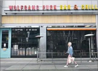  ?? Frederic J. Brown AFP/Getty Images ?? AFTER THE coronaviru­s threat passes, sit-down restaurant­s that have been forced to close are going to need generous loans, to be repaid at zero interest, to shore up their businesses.