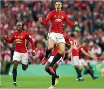  ??  ?? Zlatan Ibrahimovi­c celebrates one of his two goals in Manchester United’s 3-2 win over Souithampt­on in the League Cup final.
