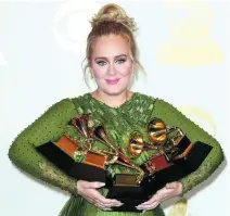  ?? Mike Nelson / EPA ?? Adele won five Grammy Awards this week.